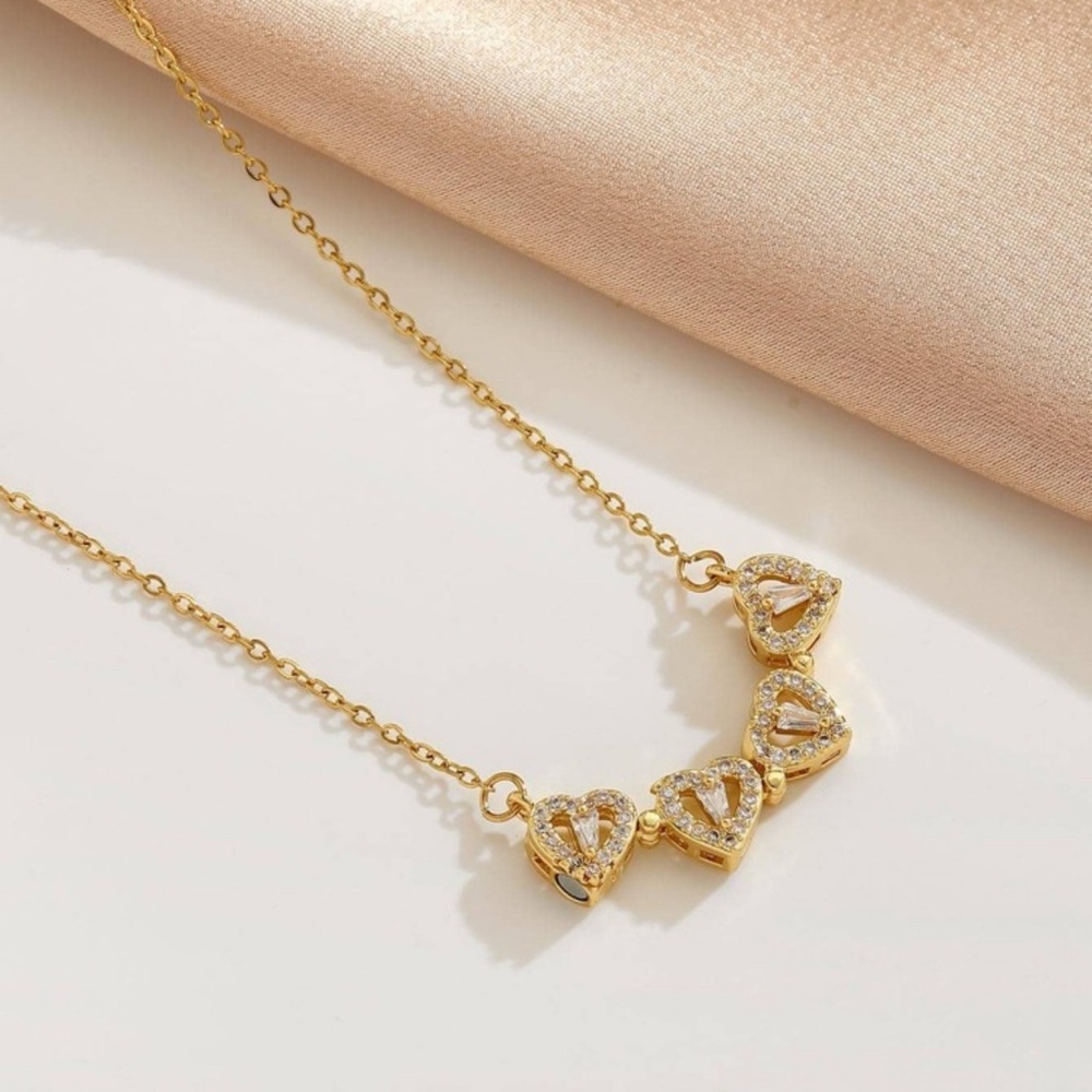 Elegant Gold Clover Pendant Necklace â€” open as four crystal hearts